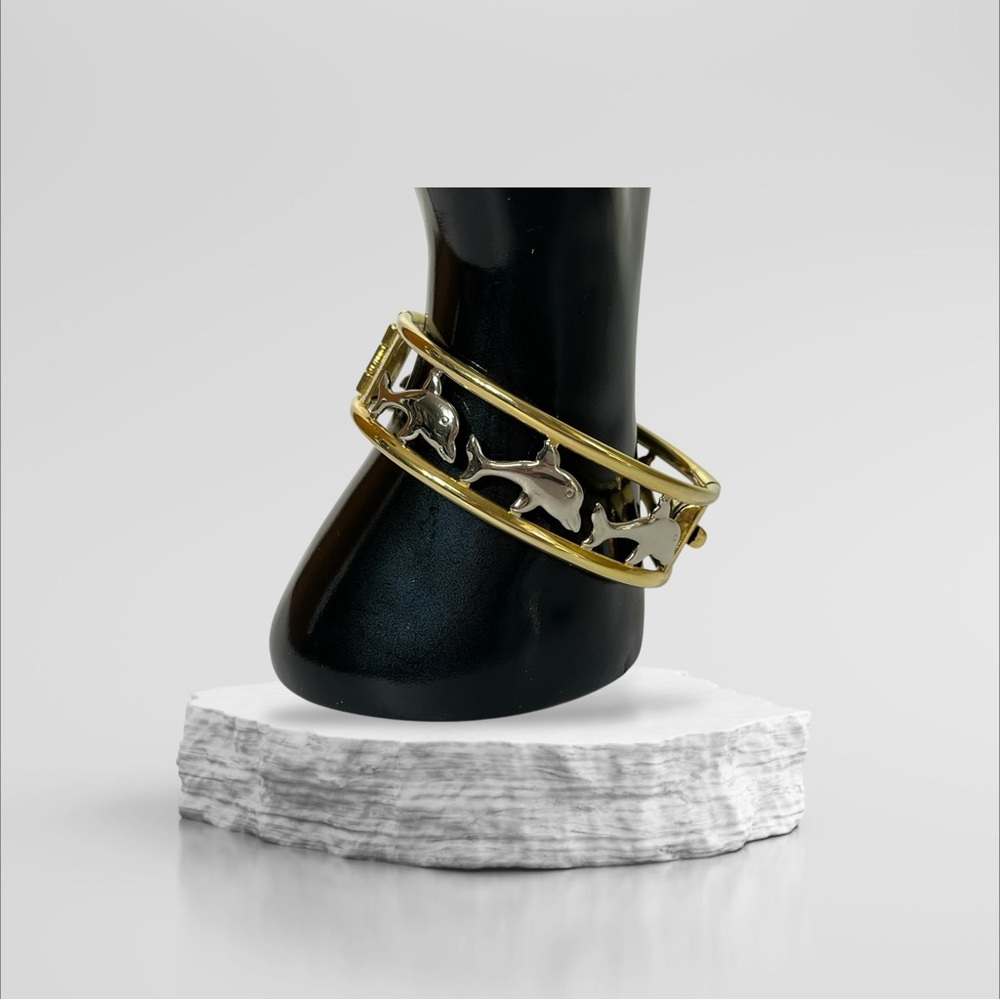 Gold Tone Metal Hinged Women's Bracelet With Silver‎ Tone Dolphins 7.75"